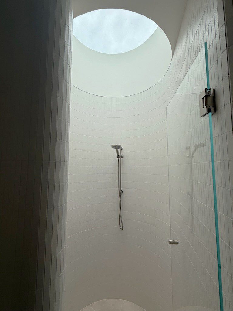 Velux Skylight above shower with the plaster modified to create a round finish